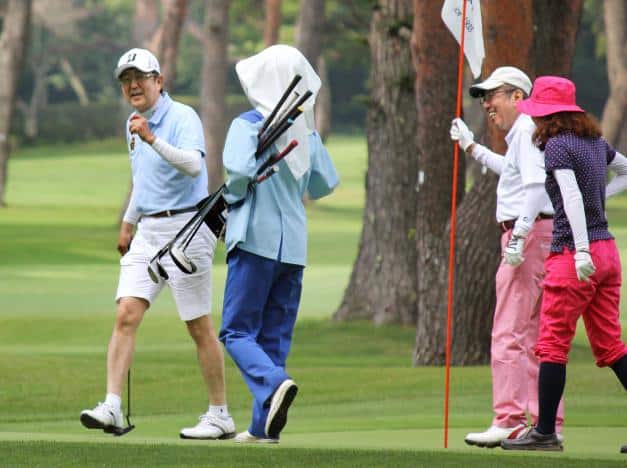 Japan's Prime Minister Shinzo Abe (L) plays golf with his friends during his summer break in Yamanakako town, Yamanashi Prefecture, Japan, in this photo taken by Kyodo August 11, 2016. Picture taken August 11, 2016. Mandatory credit Kyodo/via REUTERS