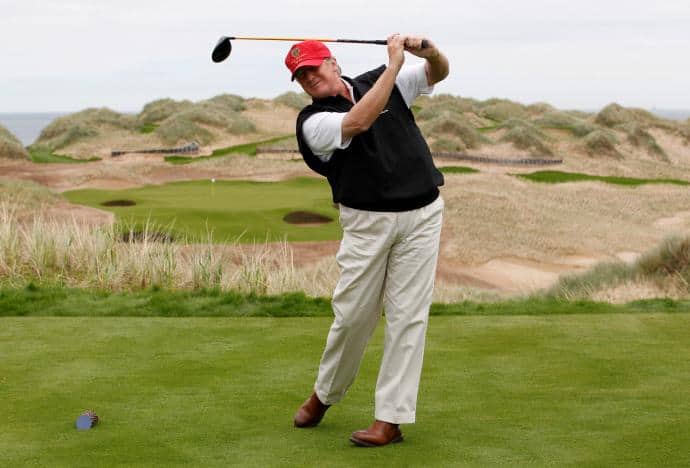 FILE PHOTO - U.S. property magnate Donald Trump practices his swing at the 13th tee of his new Trump International Golf Links course on the Menie Estate near Aberdeen, Scotland, Britain June 20, 2011. REUTERS/David Moir/File Photo